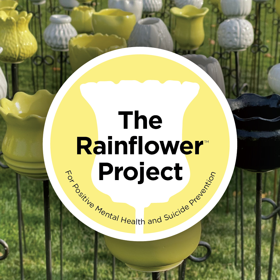 A yellow and white logo that reads "The Rainflower Project" in the shape of a flower