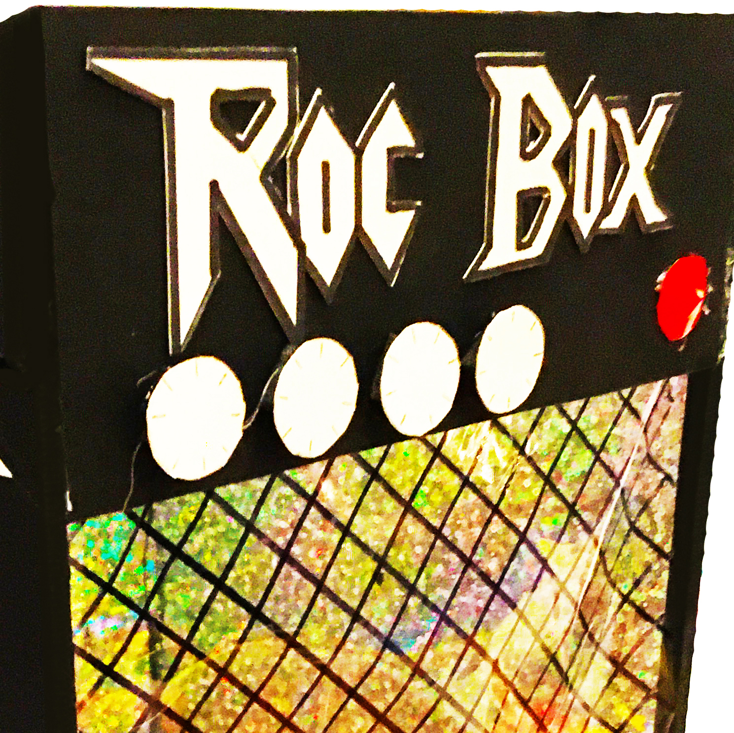 an image of a shanty shaped as an amp with the words 'roc box' above the knobs.
