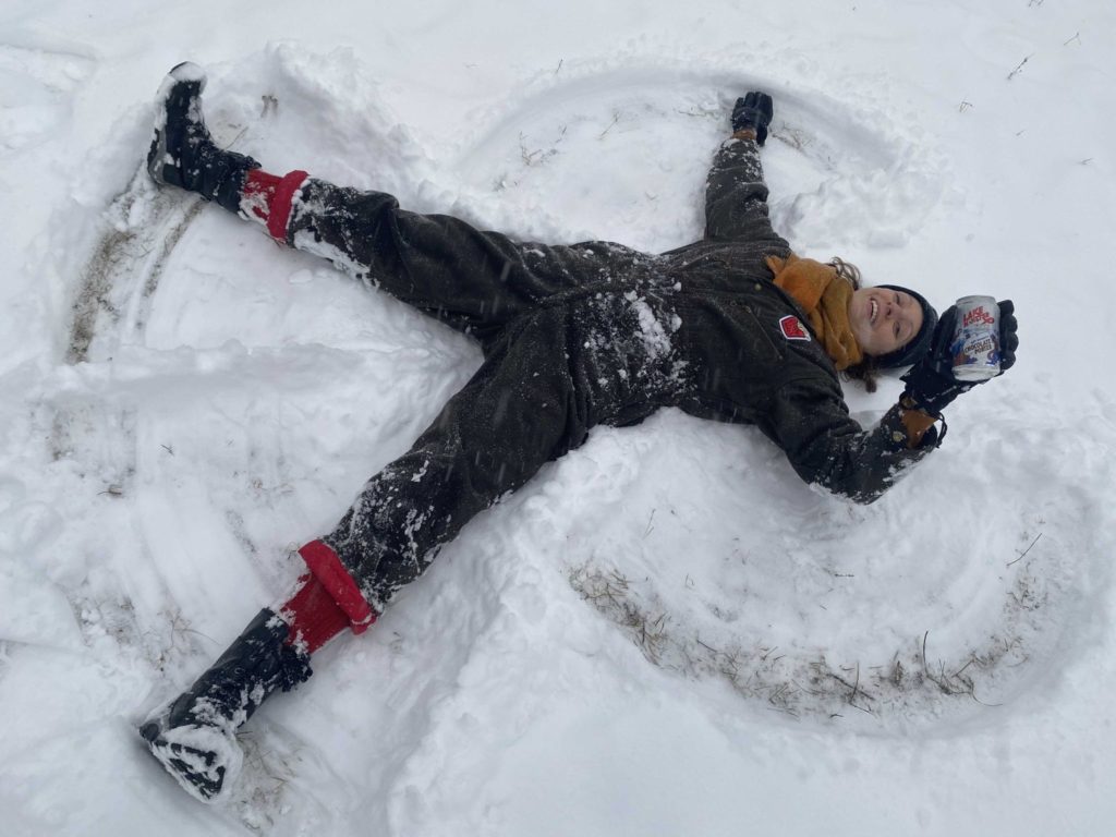 a person makes a snow angel