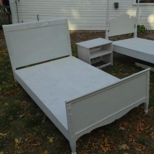 a photo of a freshly painted white bedroom set