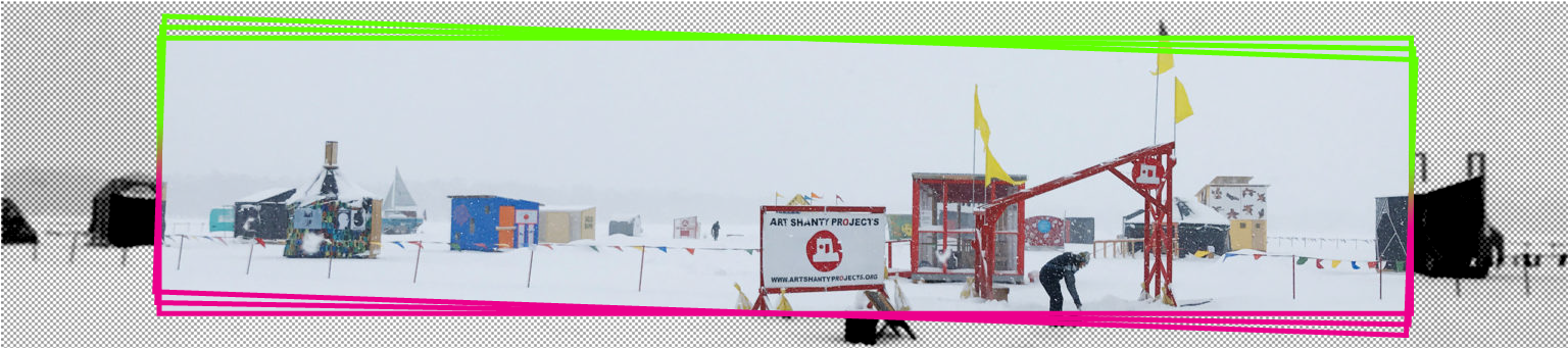 shanties on a frozen lake with a sign in front stating art shanty projects