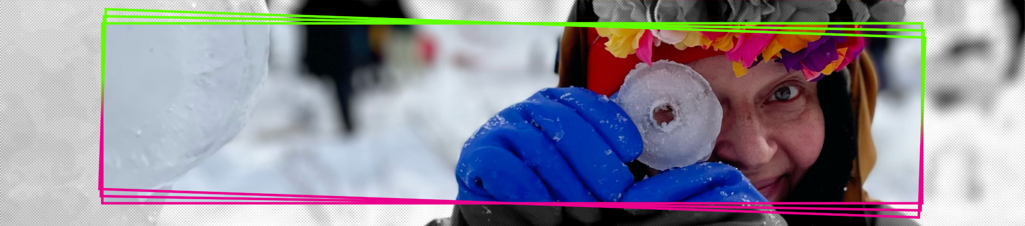 a person wearing a colorful flower crown peers through a donut-shaped piece of ice