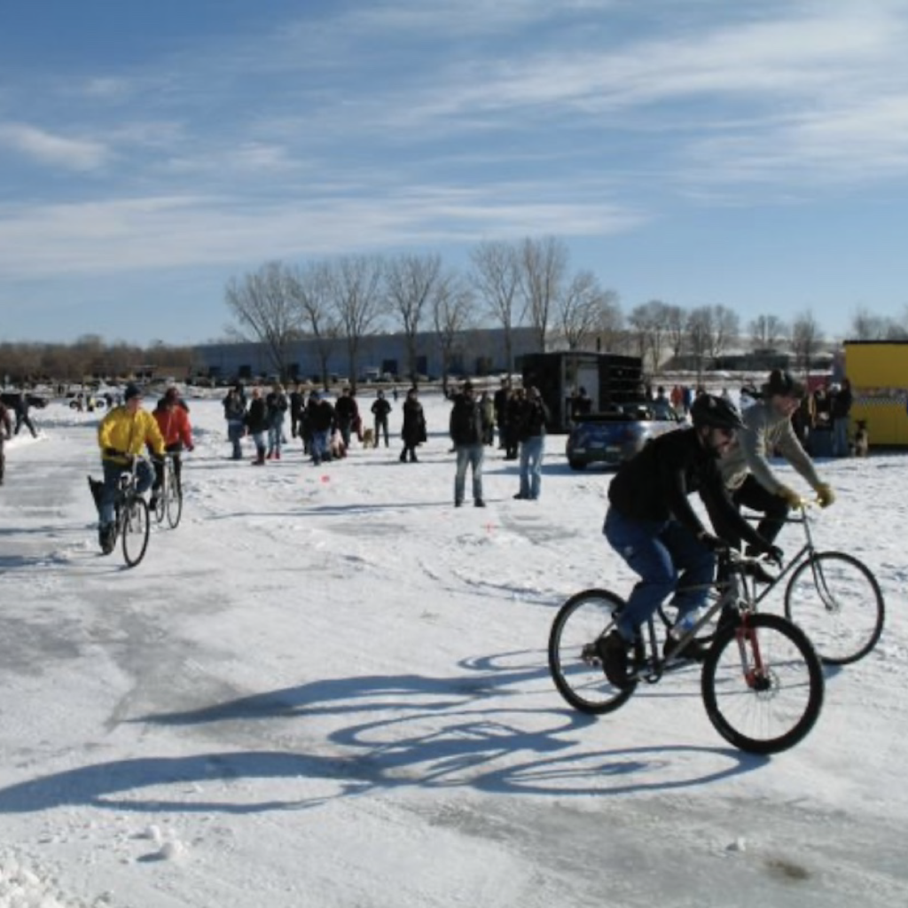 Bicycles race on a path on a frozen lake