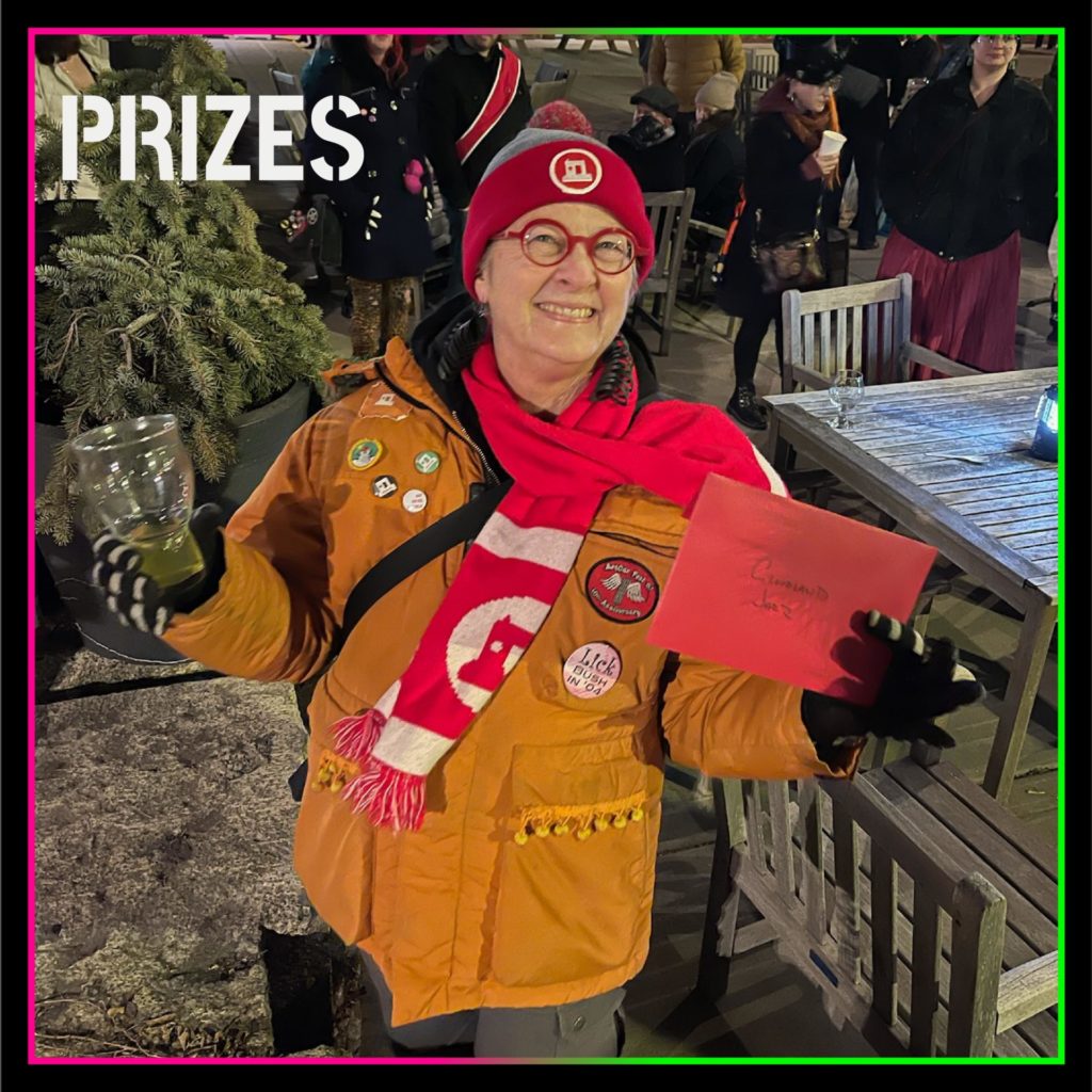 a bundled up person holding a prize